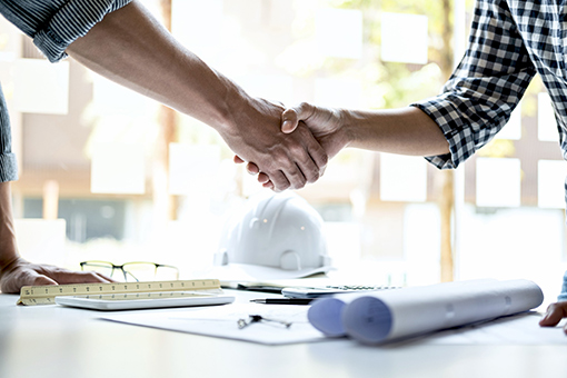 Florida License Concierge Shaking Hands of Engineer Applying for Class B HVAC Contractor License
