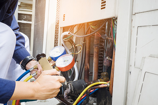 HVAC Contractor License Processing Florida Technician with HVAC Contractors License Servicing an Air Conditioning Unit